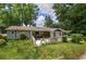 Well-maintained backyard with a patio, deck, and mature trees at 1095 Dallas Nebo Rd, Dallas, GA 30157