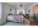 Comfortable bedroom has a ceiling fan and view of the backyard at 1095 Dallas Nebo Rd, Dallas, GA 30157