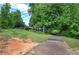Long driveway leading to the home, surrounded by lush greenery, ensuring privacy at 1095 Dallas Nebo Rd, Dallas, GA 30157