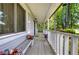 Inviting front porch featuring a bench and a view of the landscaped front yard at 1095 Dallas Nebo Rd, Dallas, GA 30157