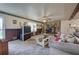 Comfortable living room featuring stone fireplace, ceiling fan and view to the yard at 1095 Dallas Nebo Rd, Dallas, GA 30157