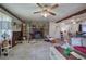Inviting living room features a stone fireplace, neutral carpet, and a comfortable seating area at 1095 Dallas Nebo Rd, Dallas, GA 30157