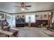 Bright living room featuring ceiling fan, large windows and a view to the outdoor area at 1095 Dallas Nebo Rd, Dallas, GA 30157