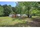Large yard with a chicken coop and shed, providing ample space for outdoor activities at 1095 Dallas Nebo Rd, Dallas, GA 30157