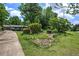 A lush green lawn and garden surrounds this one-story house, creating a serene landscape at 1095 Dallas Nebo Rd, Dallas, GA 30157
