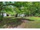 Spacious yard with mature trees, offering shade and a serene atmosphere at 1095 Dallas Nebo Rd, Dallas, GA 30157