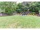 Large backyard with mature trees and a fire pit with plenty of room to entertain at 3514 Ethridge Nw Ln, Kennesaw, GA 30144
