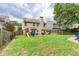 Large backyard with mature trees, a play set, and a fire pit with plenty of room to entertain at 3514 Ethridge Nw Ln, Kennesaw, GA 30144
