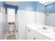 Blue and white bathroom with toilet and vanity at 3514 Ethridge Nw Ln, Kennesaw, GA 30144