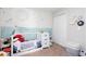 Bedroom featuring crib with celestial themed decor at 3514 Ethridge Nw Ln, Kennesaw, GA 30144