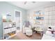 Bedroom featuring crib, rocker, and bookshelves near a bathroom at 3514 Ethridge Nw Ln, Kennesaw, GA 30144