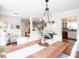 Charming dining room with hardwood floors and views of kitchen and living areas at 3514 Ethridge Nw Ln, Kennesaw, GA 30144