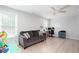 Bright living room features sleek floors, a gray sofa, and a comfortable seating area perfect for Gathering time at 3514 Ethridge Nw Ln, Kennesaw, GA 30144