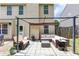 Cozy outdoor patio features comfortable seating and overhead pergola at 3514 Ethridge Nw Ln, Kennesaw, GA 30144