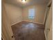 A carpeted bedroom offering a peaceful retreat at 4718 City View Dr, Forest Park, GA 30297