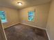 A comfortable bedroom with natural light from two windows at 4718 City View Dr, Forest Park, GA 30297