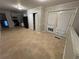 Eat in kitchen featuring neutral tile, storage, and access to a rear exterior at 4718 City View Dr, Forest Park, GA 30297
