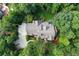 An aerial view of the home and property surrounded by lush landscaping and mature trees at 118 Whitestone Dr, Mcdonough, GA 30253