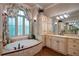 Bright bathroom with soaking tub, tile accents, and large vanity at 118 Whitestone Dr, Mcdonough, GA 30253