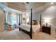 Spacious primary bedroom with tray ceiling, sitting area, and large windows at 118 Whitestone Dr, Mcdonough, GA 30253
