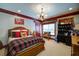 Warm and inviting bedroom with plaid bedding, lodge decor, and natural light at 118 Whitestone Dr, Mcdonough, GA 30253
