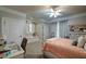 Bright bedroom with desk, window seat, neutral tones, and serene ambiance at 118 Whitestone Dr, Mcdonough, GA 30253