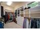 Large walk-in closet with custom shelving and ample storage for clothes and accessories at 118 Whitestone Dr, Mcdonough, GA 30253