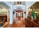 Grand foyer with hardwood floors, console table, and a view into the dining room at 118 Whitestone Dr, Mcdonough, GA 30253