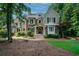 Charming stone and shingle home featuring a landscaped front yard and inviting entrance at 118 Whitestone Dr, Mcdonough, GA 30253