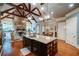Spacious kitchen with exposed wood beams, stone fireplace, and granite countertops at 118 Whitestone Dr, Mcdonough, GA 30253