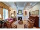 Relaxing living room features fireplace, coffered ceiling, and elegant decor at 118 Whitestone Dr, Mcdonough, GA 30253