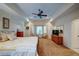 Comfortable main bedroom with a large bay window, en-suite bathroom, and a ceiling fan at 118 Whitestone Dr, Mcdonough, GA 30253