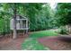 Charming treehouse with ladder access, surrounded by trees in a spacious backyard at 118 Whitestone Dr, Mcdonough, GA 30253