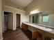 Large bathroom with double sinks, a large mirror, separate shower and a soaking tub at 257 Juliet Dr, Hampton, GA 30228