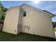 View of the home's exterior showing the siding and satellite dish on a well-maintained lot at 257 Juliet Dr, Hampton, GA 30228