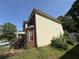 Home's exterior with brick accents, well-manicured landscaping, and a bay window at 257 Juliet Dr, Hampton, GA 30228