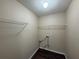 Laundry room with utility hookups and wire shelving at 257 Juliet Dr, Hampton, GA 30228