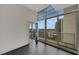 Bright room with access to balcony with views of the city skyline through expansive windows at 44 Peachtree Nw Pl # 2024, Atlanta, GA 30309