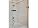 Bathroom showcasing modern shower with glass door and designer tile at 44 Peachtree Nw Pl # 2024, Atlanta, GA 30309