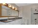 Bathroom featuring a double vanity, glass shower and modern fixtures at 44 Peachtree Nw Pl # 2024, Atlanta, GA 30309