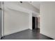 Empty bedroom with dark floors and an attached closet at 44 Peachtree Nw Pl # 2024, Atlanta, GA 30309