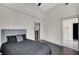 Bedroom with dark floors and a view into the ensuite bathroom at 44 Peachtree Nw Pl # 2024, Atlanta, GA 30309