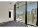 Bedroom featuring expansive windows with city views and a walk-in closet at 44 Peachtree Nw Pl # 2024, Atlanta, GA 30309