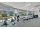 Bright fitness center equipped with modern machines, offering a great workout experience with city views at 44 Peachtree Nw Pl # 2024, Atlanta, GA 30309
