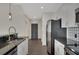 Well-appointed kitchen with stainless steel appliances, granite countertops, and sleek cabinets at 44 Peachtree Nw Pl # 2024, Atlanta, GA 30309