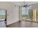 Living room with hardwood floors, large windows, and city views at 44 Peachtree Nw Pl # 2024, Atlanta, GA 30309