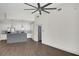 Open concept living space featuring a modern kitchen, hardwood floors, and high ceilings at 44 Peachtree Nw Pl # 2024, Atlanta, GA 30309