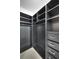Walk-in closet featuring dark cabinets and ample storage space at 44 Peachtree Nw Pl # 2024, Atlanta, GA 30309