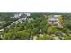 Aerial view of the home surrounded by lush trees, showcasing the neighborhood and setting at 66 Mobile Ne Ave, Atlanta, GA 30305