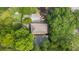 Aerial view of the home's roof, showcasing its landscaping, driveway, and surrounding trees at 66 Mobile Ne Ave, Atlanta, GA 30305